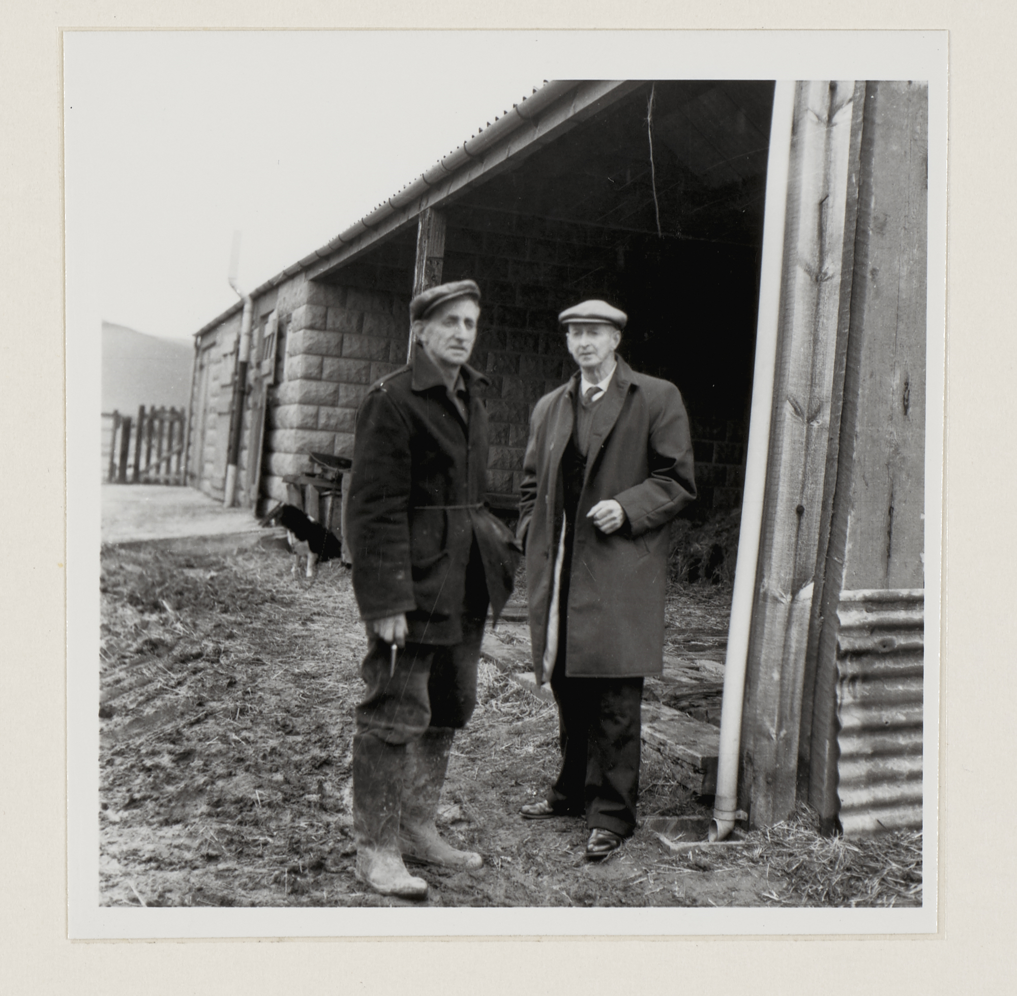 Two people standing outside a building