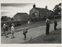 People and children playing a game
