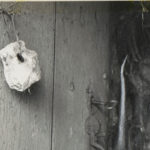 A stone hanging from a wooden door