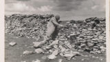 Man repairing a dry stone wall.