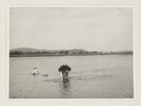 Two men fishing for salmon in the River Nith near Glencaple (Dumfries and Galloway) with haaf nets.