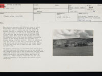 Photocard with black and white landscape image.