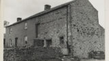 Dales farmstead with house and barn adjoining in one long building, at Marrick Moor ( Arkengarthdale). A wall divides the house and barns/cowshed.