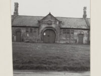 Blacksmith's shop with horseshoe-shaped doorway, in Roxby (North Yorkshire).