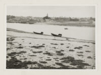 Two salmon cobles with nets laid on the back, on the shore of the River Tweed at Tweedmouth (Northumberland).