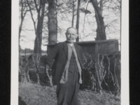 Survey of English Dialects informant, [Tom Cornell], in the garden of his home.